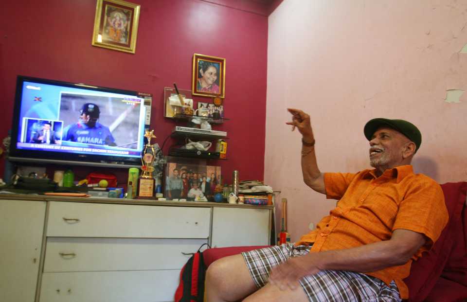 Sachin Tendulkar's coach, Ramakant Achrekar, watches him get his 100th century