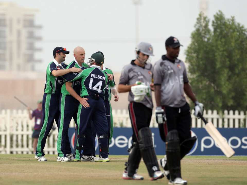The Ireland players celebrate a wicket