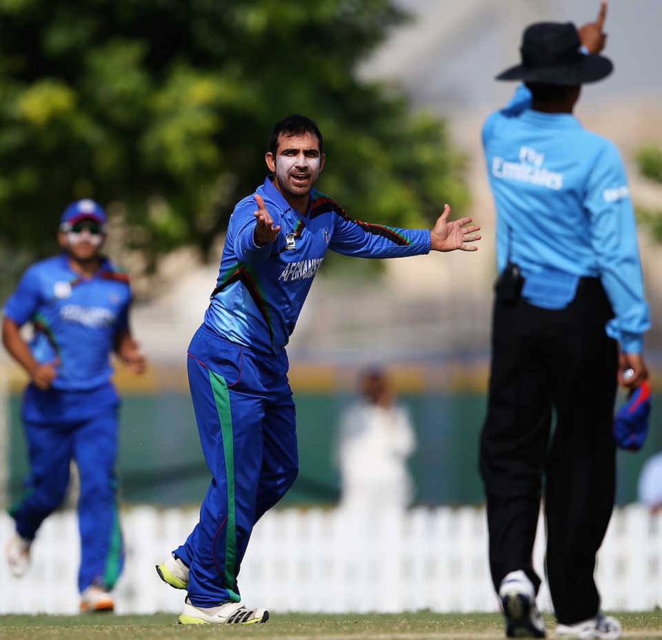 Samiullah Shenwari appeals successfully for a caught and bowled chance, Afghanistan v Bermuda, ICC World T20 Qualifiers, Dubai, November 20, 2013