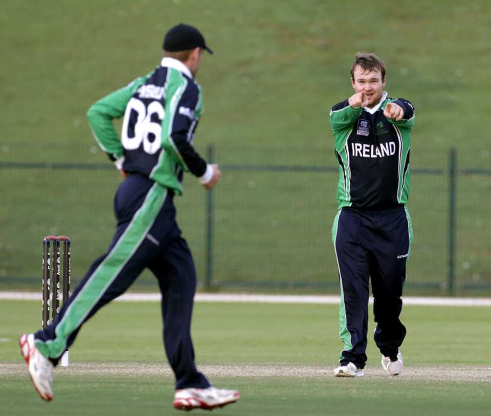 Paul Stirling celebrates after taking a wicket