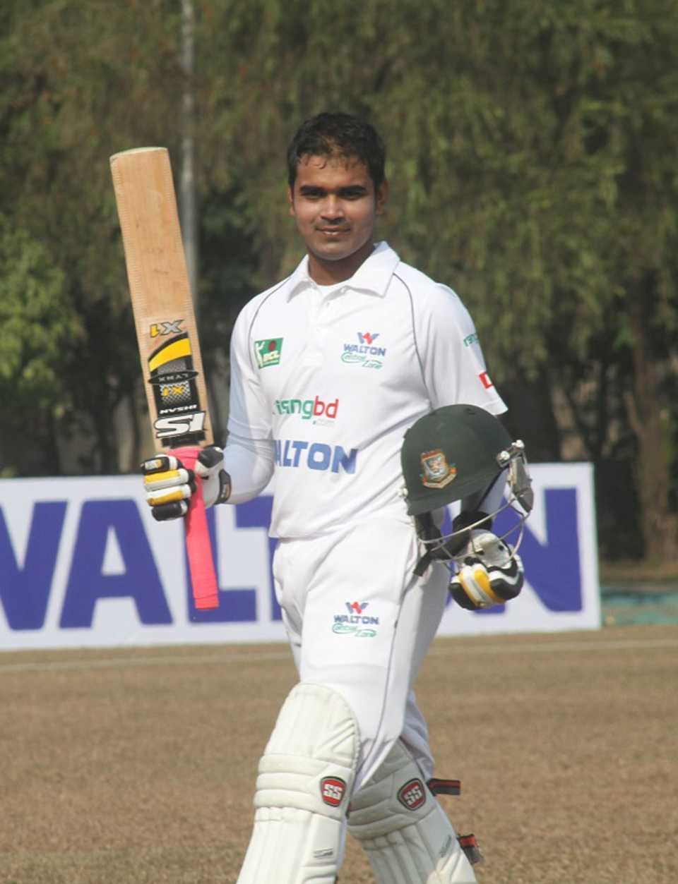 Shamsur Rahman raises his bat during his innings of 267