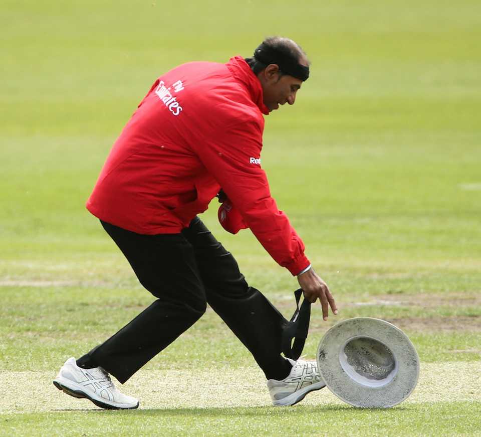 Gone with the wind: Umpire Enamul Haque loses his hat