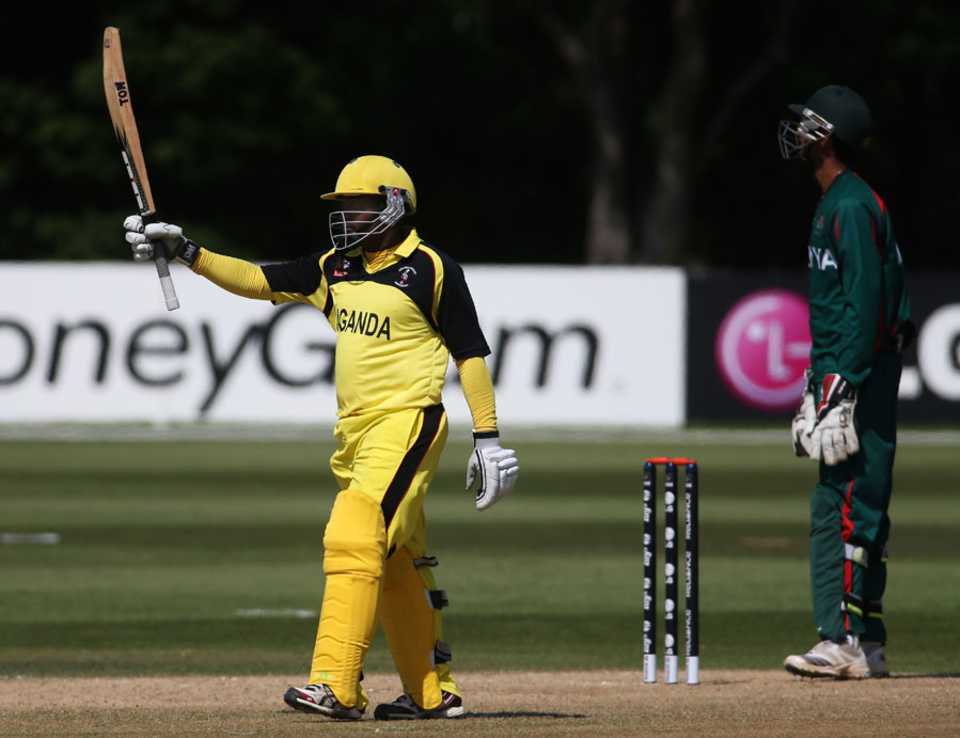 Lepono Ndhlovu raises his bat after reaching 50