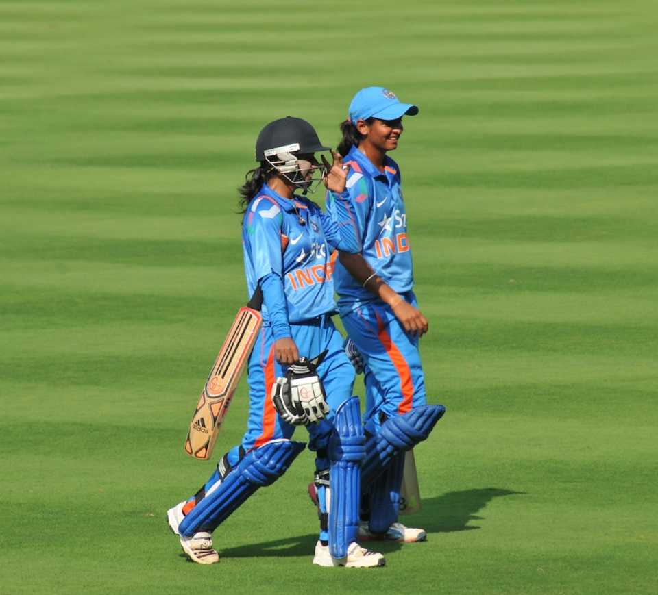 Mithali Raj and Harmanpreet Kaur walk back after the win