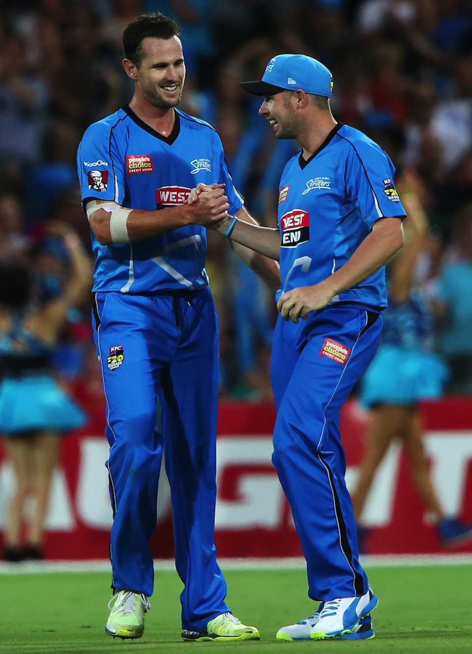 Shaun Tait is congratulated after taking a wicket