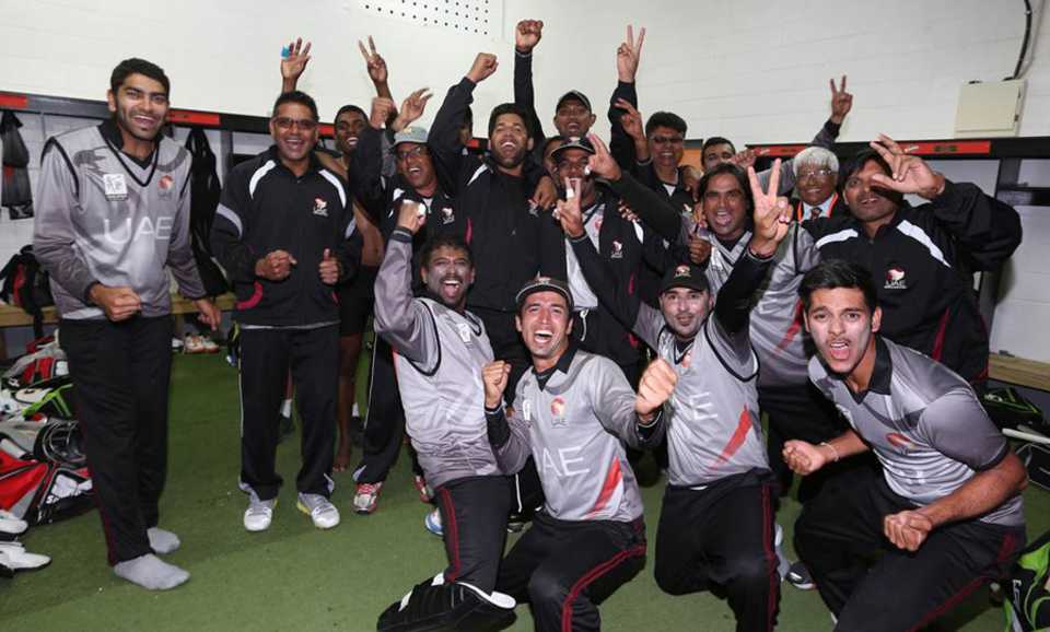 The UAE players celebrate after qualifying for the 2015 World Cup