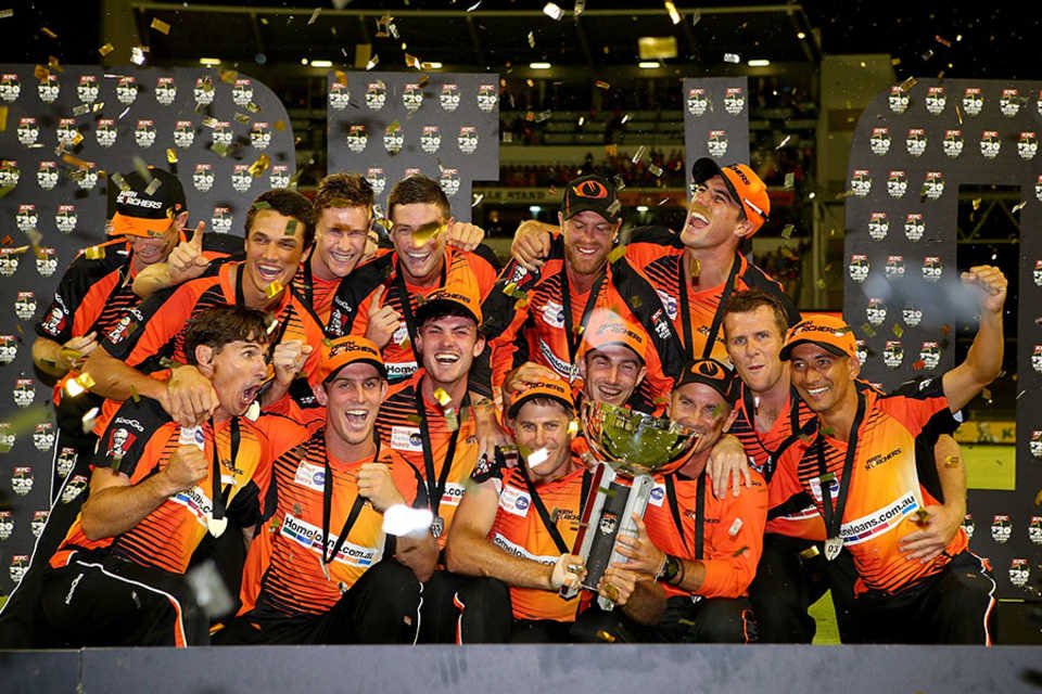 Confetti rains down on the Perth Scorchers players as they celebrate winning the Big Bash League