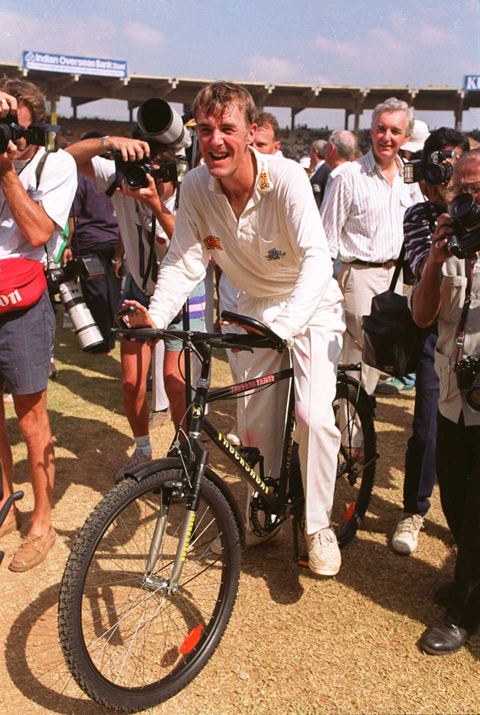 Phil Tufnell rides a bike at the end of the Test