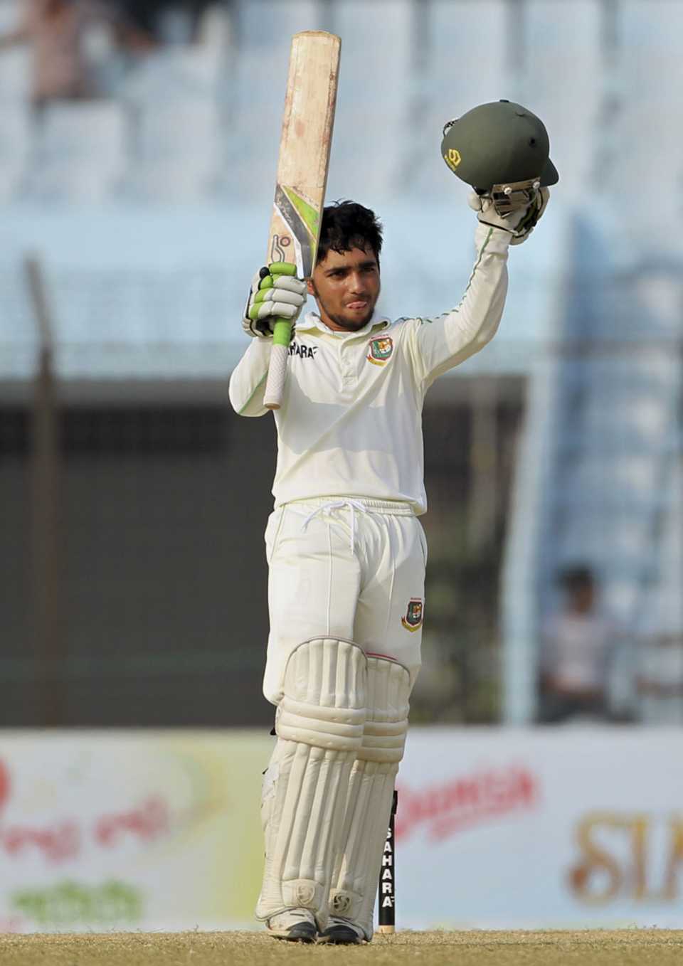 Mominul Haque raises his bat after reaching his third Test hundred