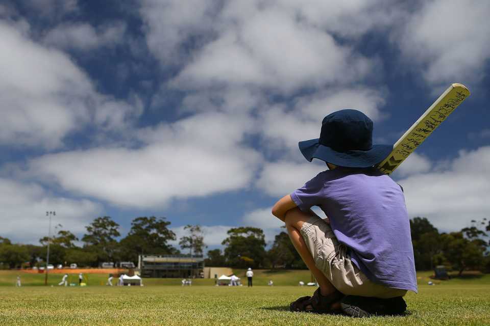 A kid watches the tour game from the sidelines, England v Australia A, women's tour match, Perth, 2nd day, January 7, 2013