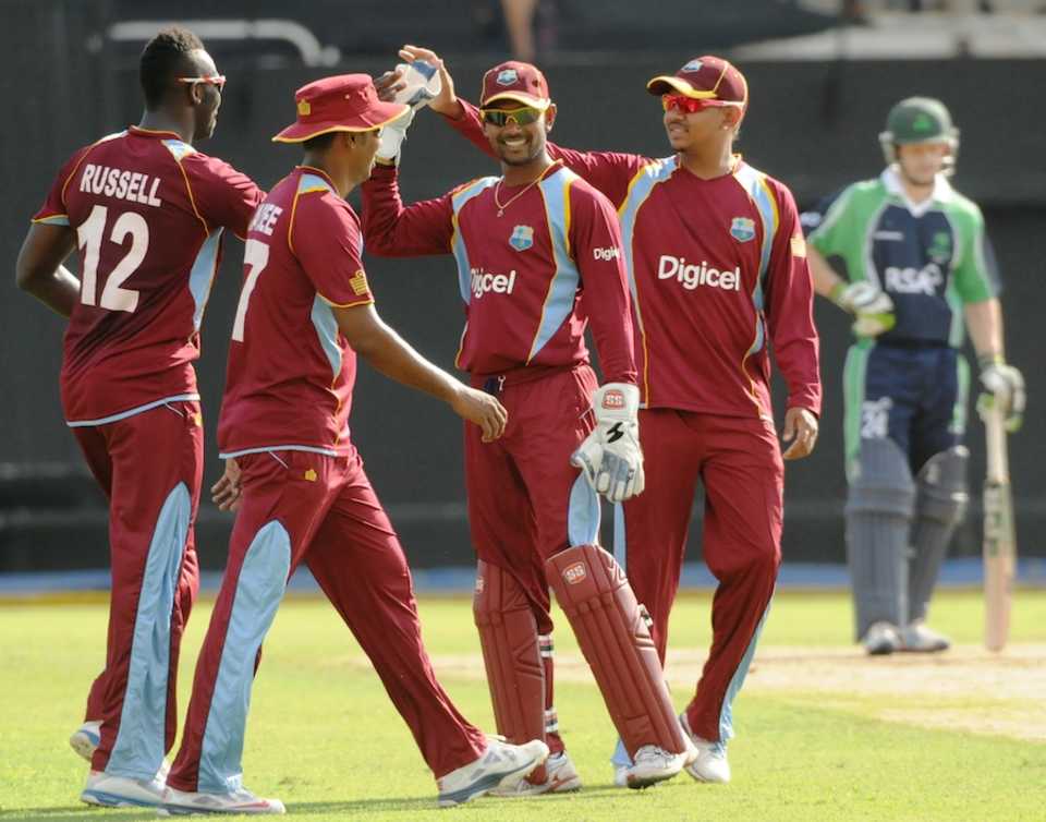 Denesh Ramdin celebrates a wicket with team-mates