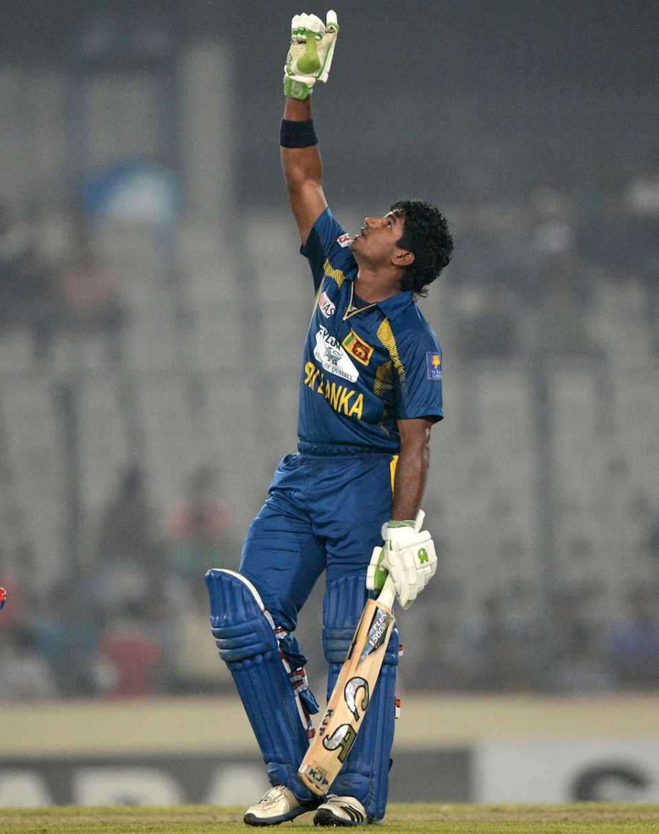 Kusal Perera gestures to the sky after reaching his ton