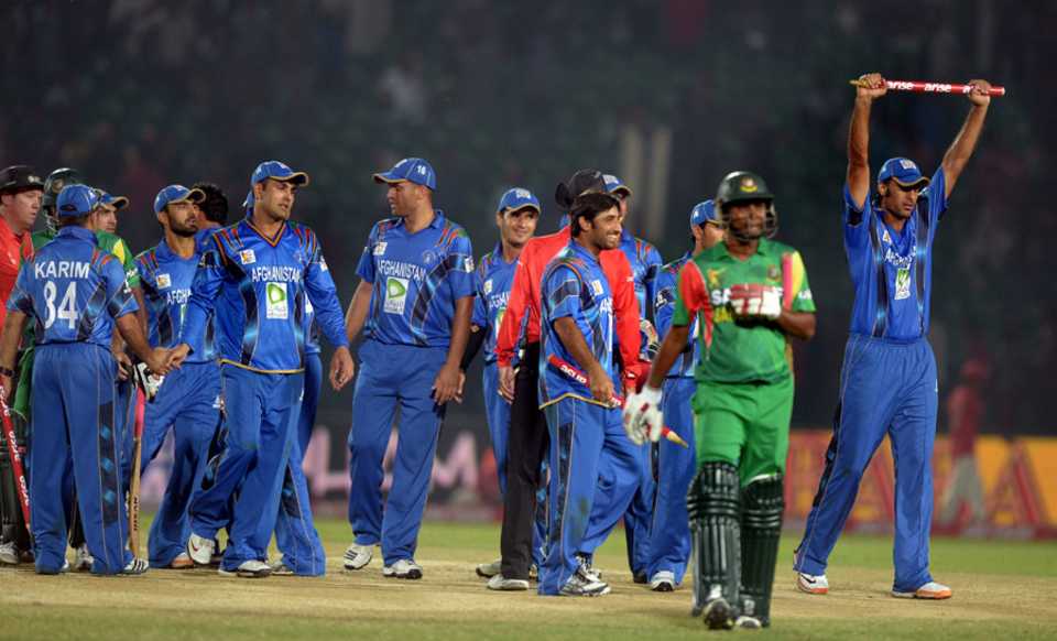The Afghanistan players celebrate their landmark win, Bangladesh v Afghanistan, Asia Cup, Fatullah, March 1, 2014
