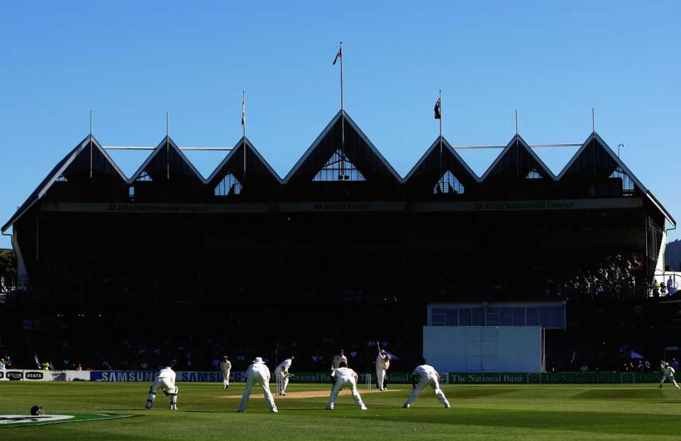 Stuart Broad bowls with the RA Vance Stand in the backdrop