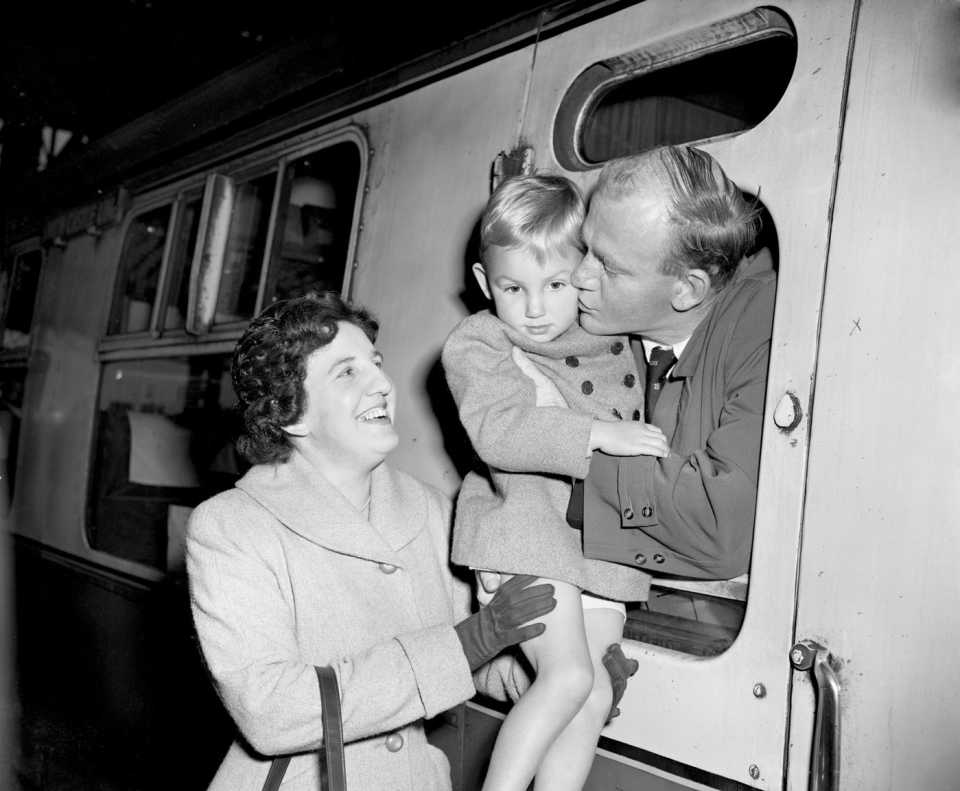 Tony Lock kisses his son goodbye at Waterloo Station before leaving for England's tour of South Africa