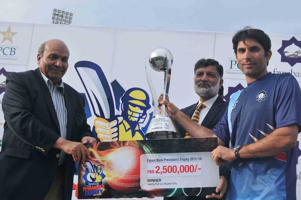 Misbah-ul-Haq receives the trophy after the win