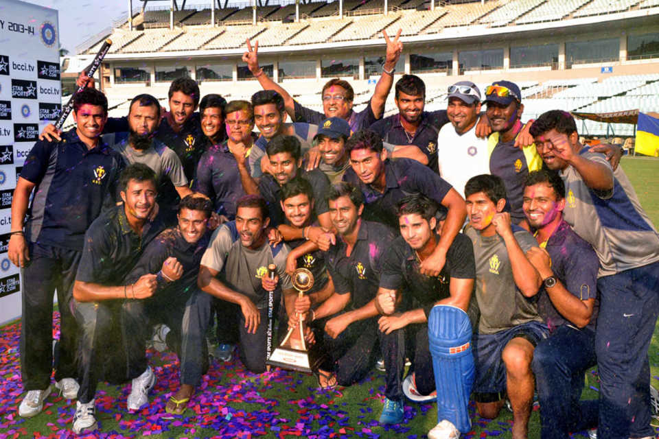 The Karnataka team celebrate their Vijay Hazare title win with colour