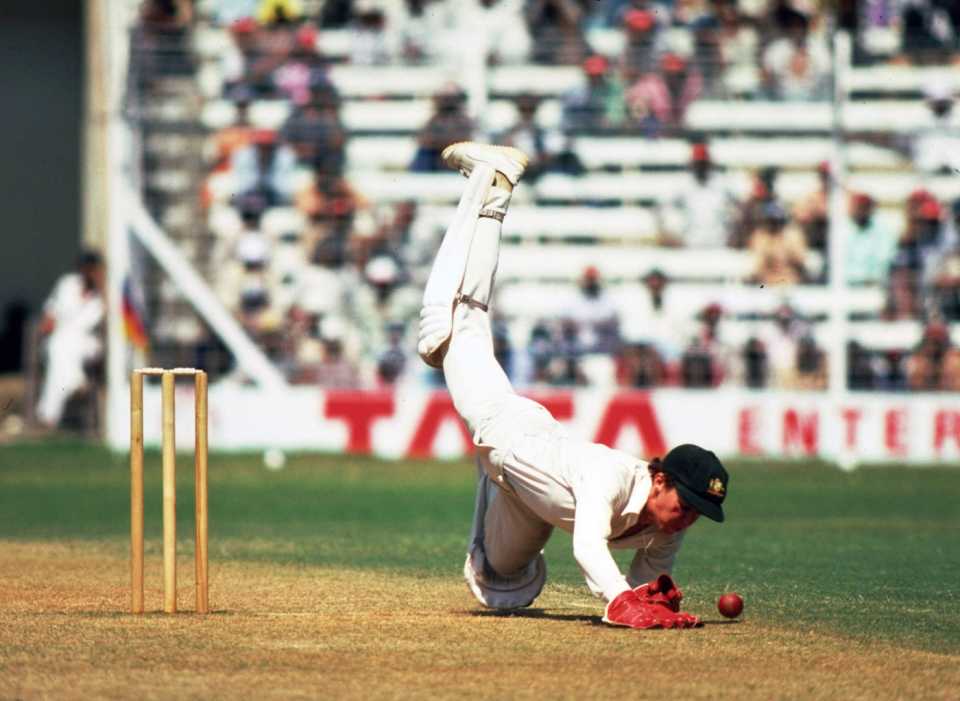 Australian wicketkeeper Kevin Wright dives for the ball