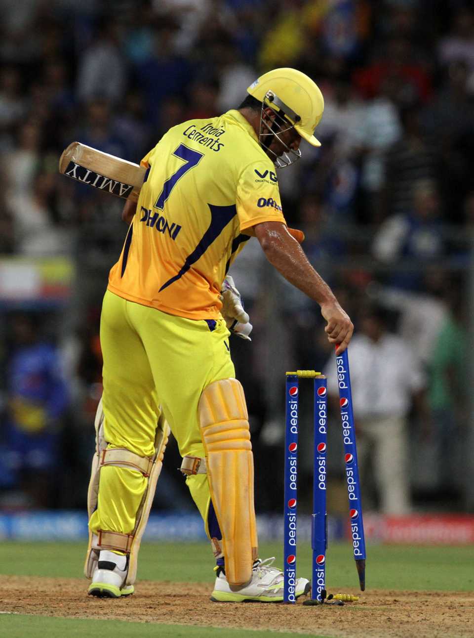 MS Dhoni collects a stump after hitting the winning runs
