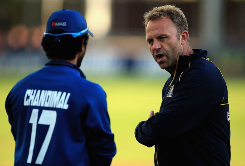 Sri Lanka's batting consultant Chris Adams gives some advice to Dinesh Chandimal, Essex v Sri Lankans, Tour match, Chelmsford, May 13, 2014