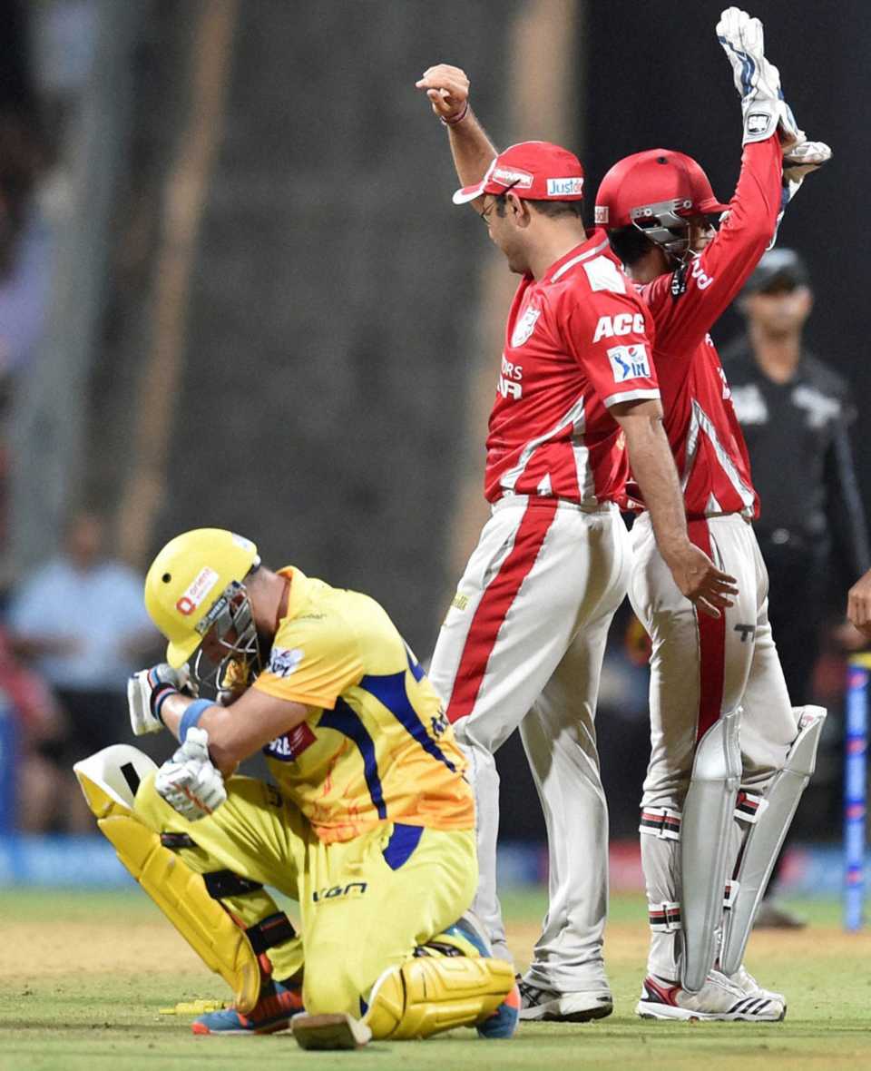 Virender Sehwag and Wriddhiman Saha celebrate a Super Kings wicket