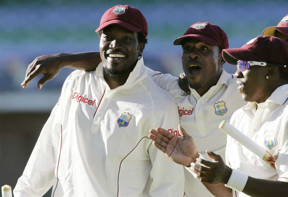 Chris Gayle celebrates a historic win with his team-mates