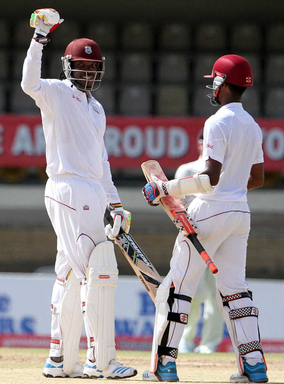 Chris Gayle and Kraigg Brathwaite celebrate West Indies' win, West Indies v New Zealand, 2nd Test, Port of Spain, 5th day, June 20, 2014