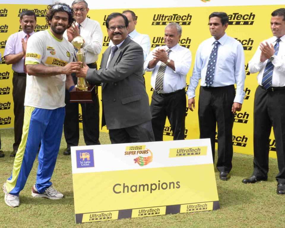 Southern Express captain Lasith Malinga accepts the trophy