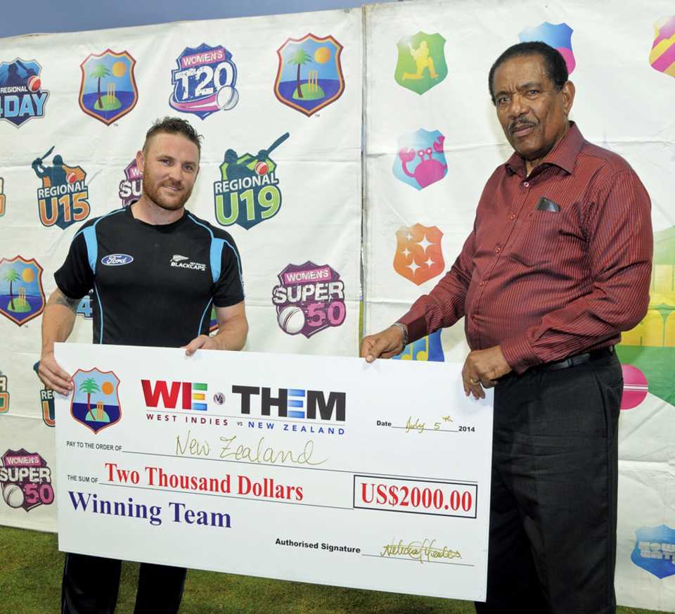 Brendon McCullum with the winner's cheque, West Indies v New Zealand, 1st T20I, Roseau, July 5, 2014