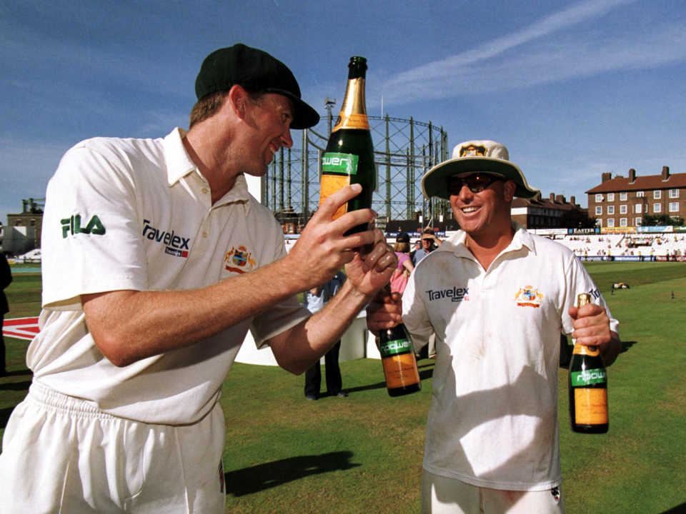 Glenn McGrath and Shane Warne celebrate the innings win