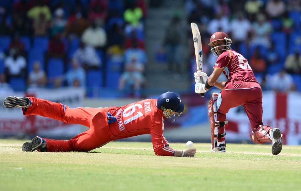Joe Root dives to save a shot from Lendl Simmons' bat, West Indies v England, 1st ODI, North Sound, February 28, 2014