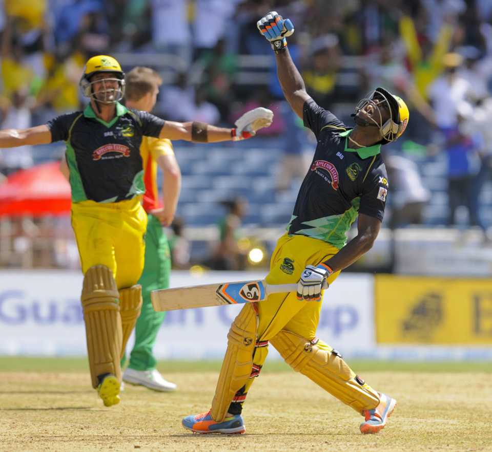 Andre Russell and Owais Shah celebrate the Tallawahs' win
