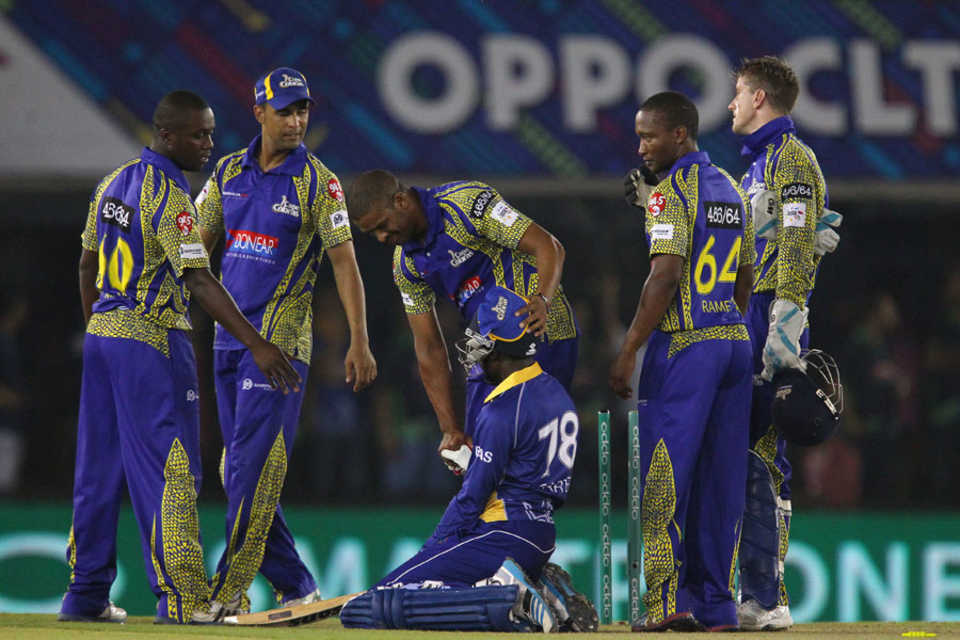 A distraught Jonathan Carter is consoled by the Cobras players
