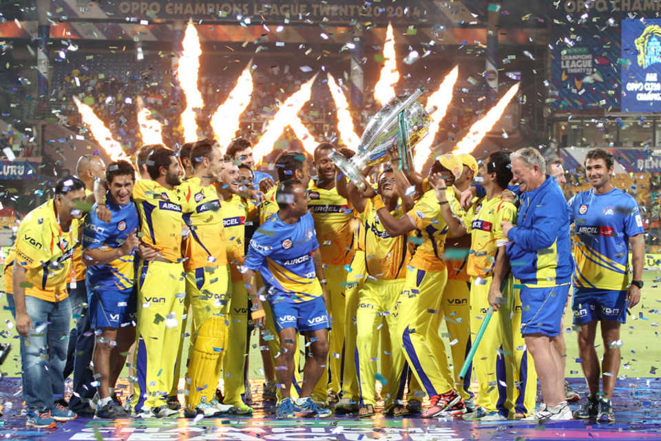 The Chennai Super Kings players celebrate with the Champions League trophy