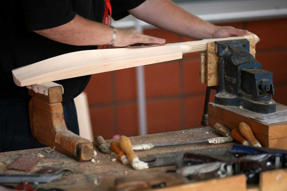A bat being crafted in the Gray-Nicolls stand at The Oval 