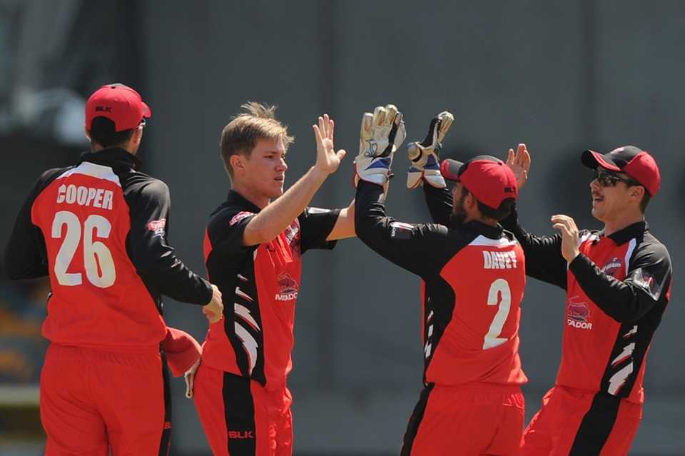 Adam Zampa celebrates one of his four wickets