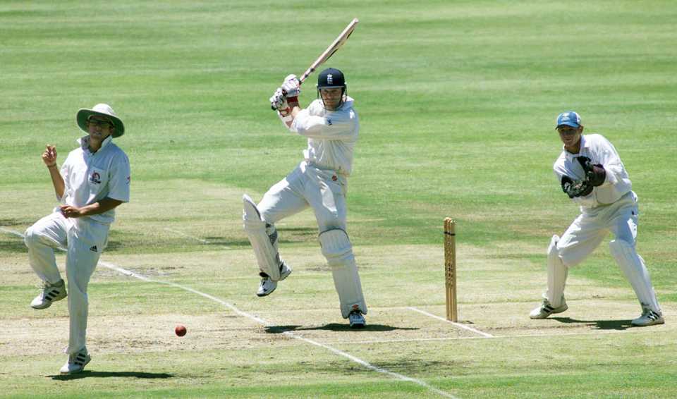 Nick Knight on his way to a century watched by wicketkeeper Wendell Bossenger