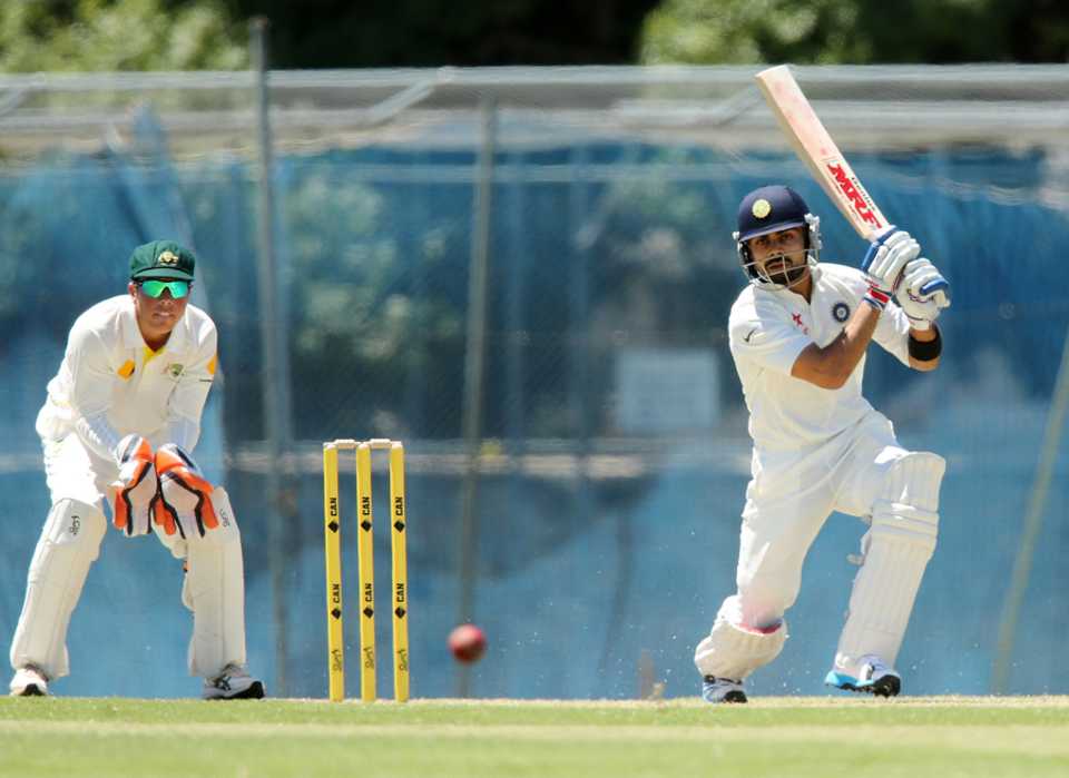 Virat Kohli drives on his way to a half-century
