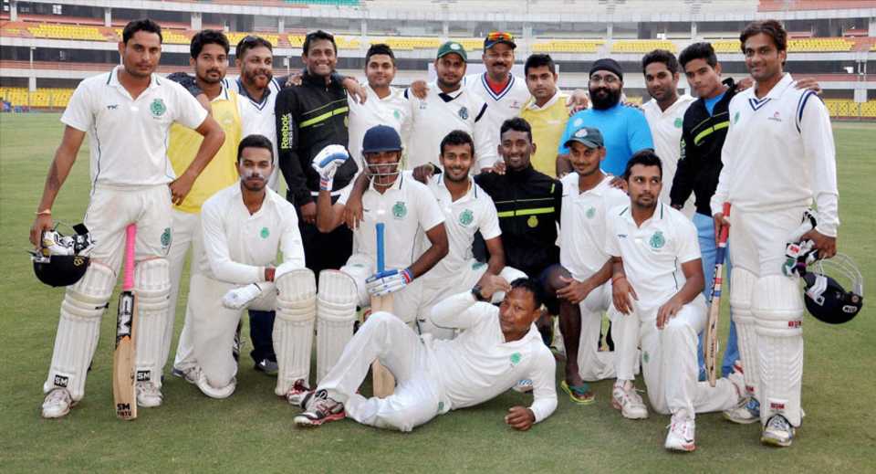 The Assam players pose for a team picture after beating Services