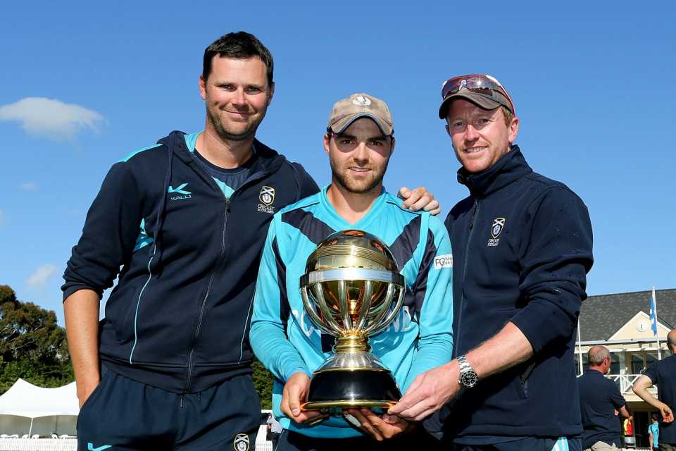 Craig Wright and Paul Collingwood flank Preston Mommsen, holding the World Cup Qualifier trophy, Scotland v UAE, World Cup Qualifier, final, Lincoln, February 1, 2014