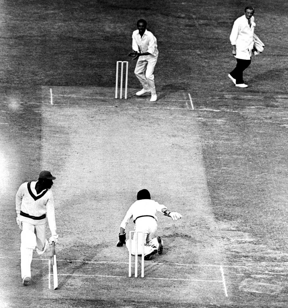 Clive Lloyd makes his ground as keeper Deryck Murray throws the ball to Lance Gibbs at the non-striker's end