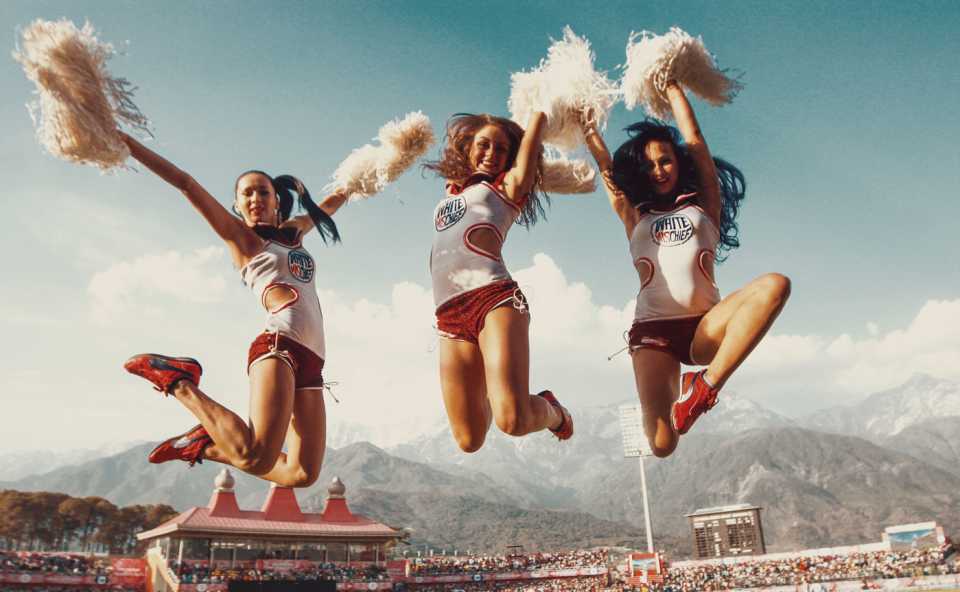 Cheerleaders perform during a break in play