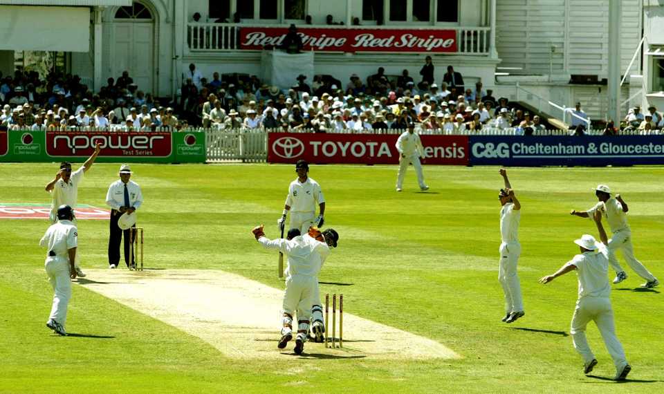 Ashley Giles celebrates the wicket of Chris Cairns