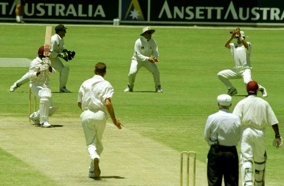 Brian Lara is caught for 44 by Mark Waugh off Paul Reiffel