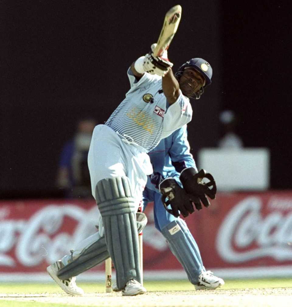 Vinod Kambli launches the ball back over the bowler, England v India, Coca Cola Cup, Sharjah, April 11, 1999 