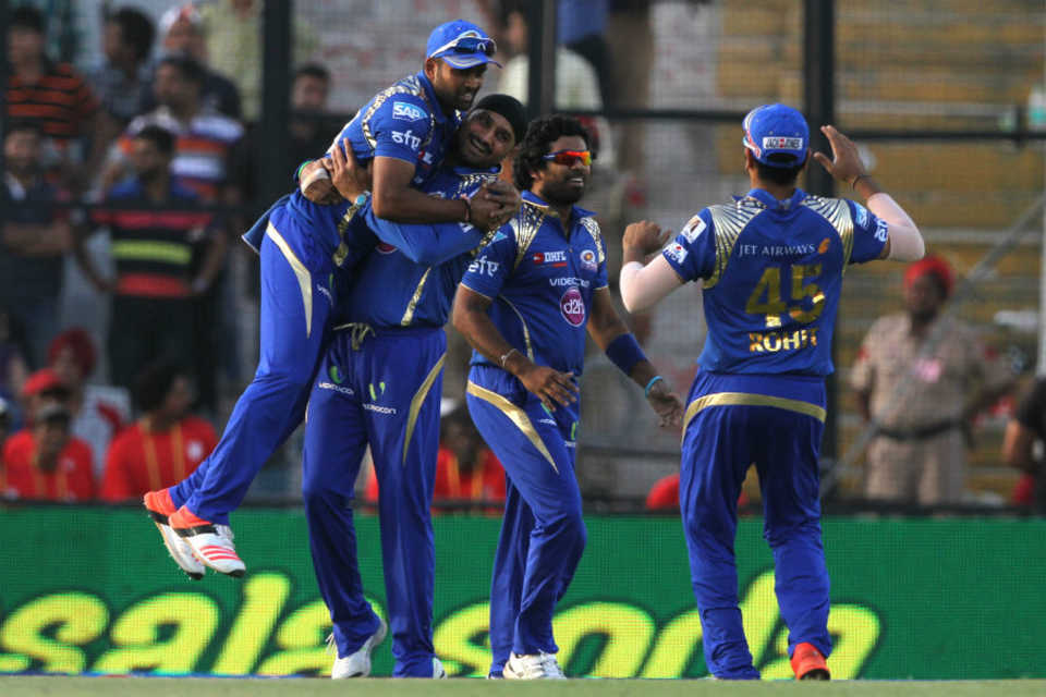 Harbhajan Singh celebrates a wicket with his team-mates