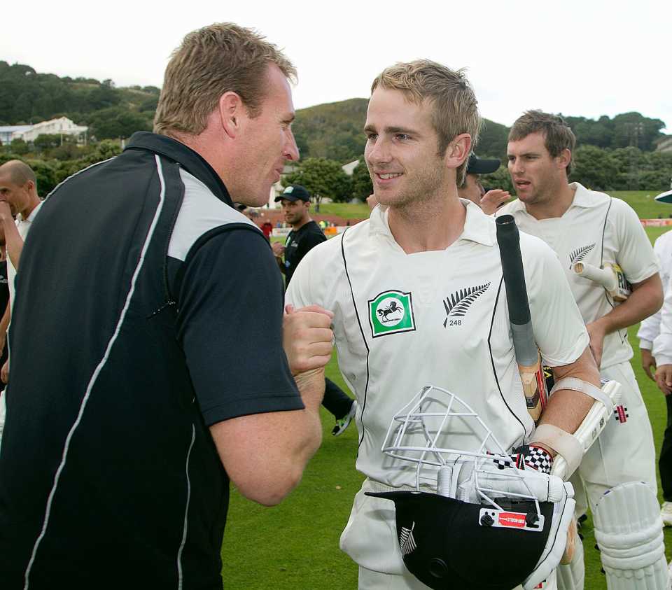 Kane Williamson is congratulated by New Zealand bowling coach Damien Wright after securing a draw