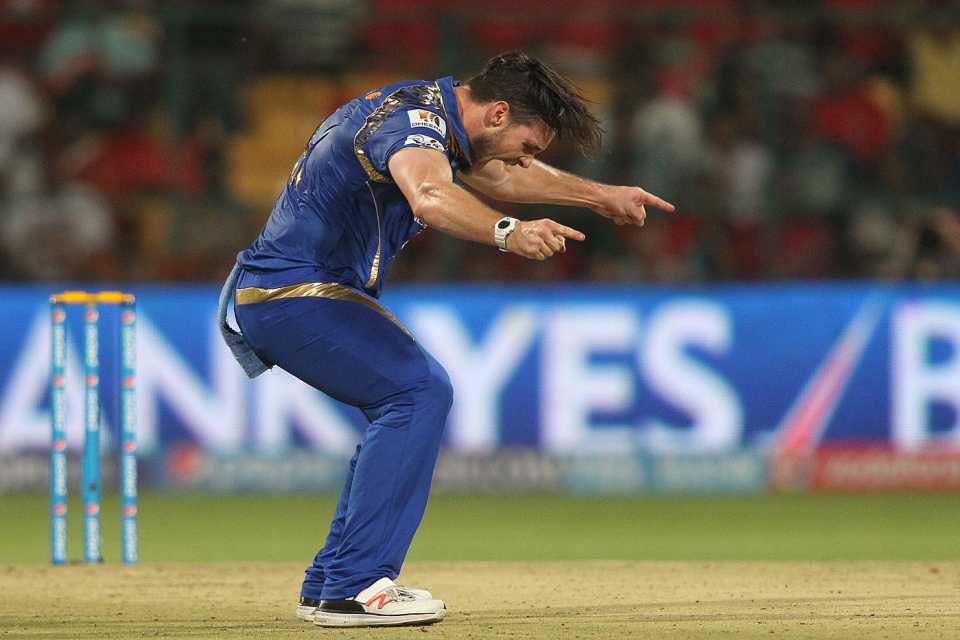Mitchell McClenaghan celebrates a wicket