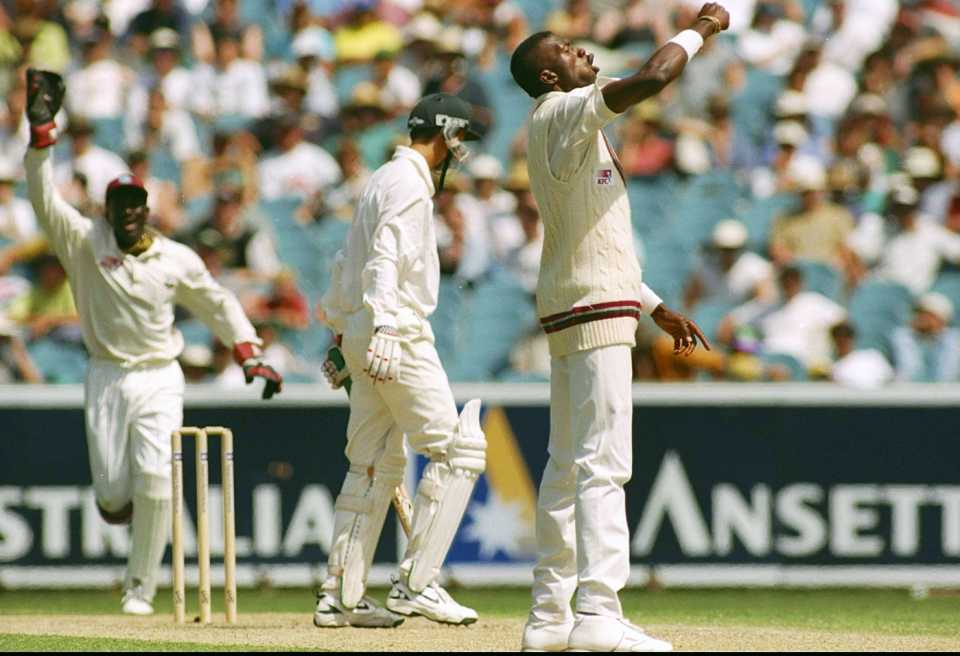 Curtly Ambrose punches the air as he celebrates a wicket