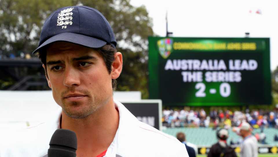 A dejected Alastair Cook talks to the media